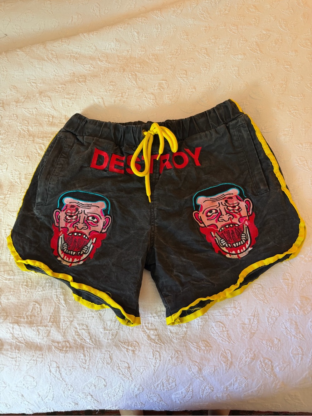 Black Men's Graphic Running Shorts with Yellow Trim
